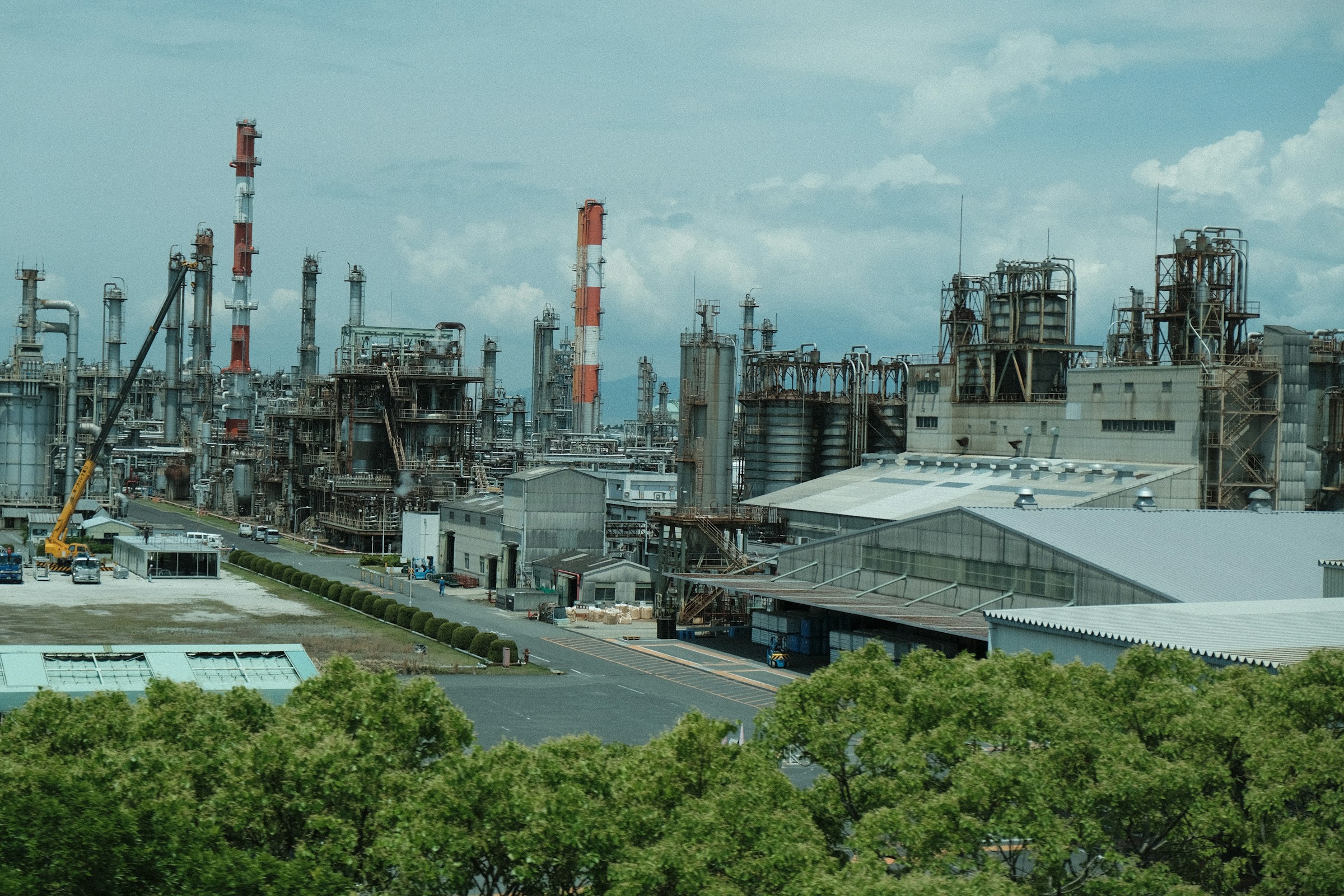 Process towers, tanks and utilities across an industrial facility