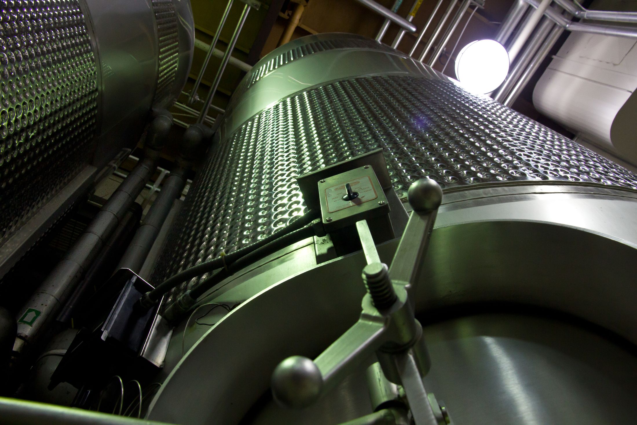 Close view of stainless steel process vessels and integrated pipework